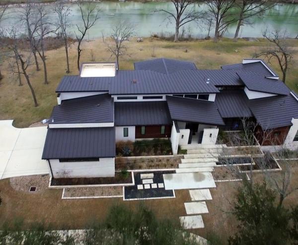 Exterior of sleek, Hill Country modern home rebuilt following the 2015 flood. SUBMITTED PHOTOS