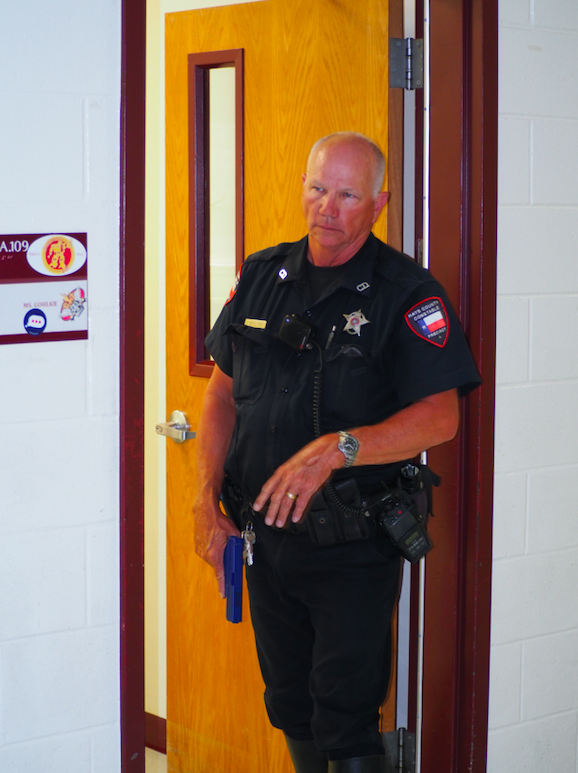 Pct. 4 Deputy Chick Williams secures a school room and hallway for EMS as part of an integrated response exercise.
