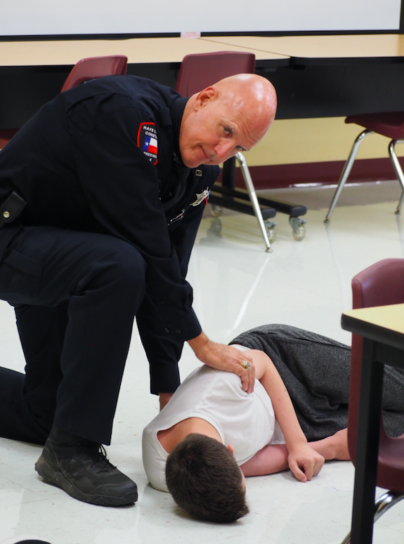 Pct. 4 Deputy Jimmy Zuehlke attends a simulated victim.
