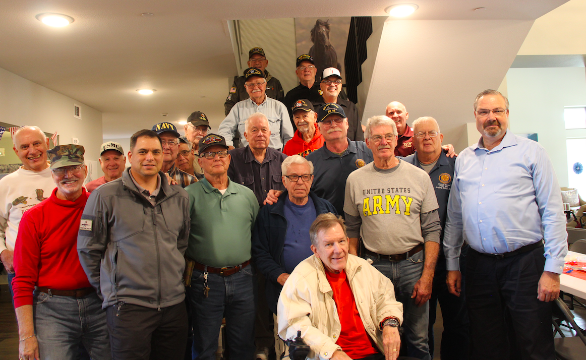 At the end of the lunch, nearly 20 veterans gathered to take a group photo together.