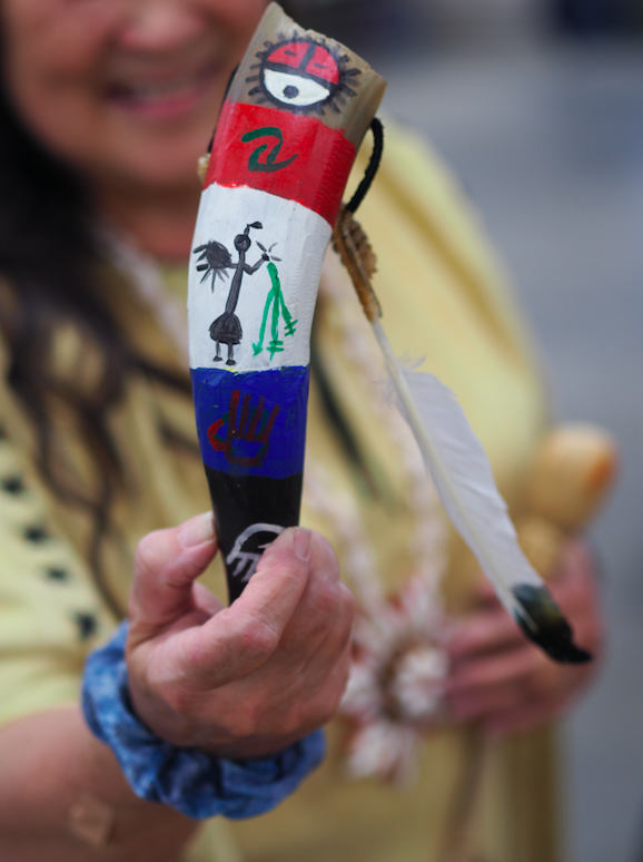 Julie Land Bridges holds a rattle that was made in the manner of native American Indians. A hollowed-out cow horn filled with rattlesnake tails.