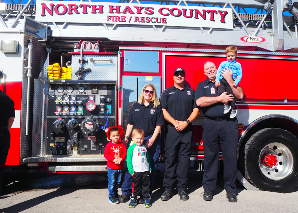 North Hays County Fire/Rescue Firefighters Rebekah Swartz, Tony Crimando, and Dean Rudolph gave kids a tour of the new ladder truck.
