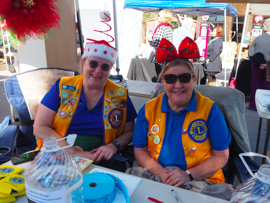 Lions Club members Sharon Kemp and Mary Lefebvre chatted up the Texas Lions Camp For Kids.